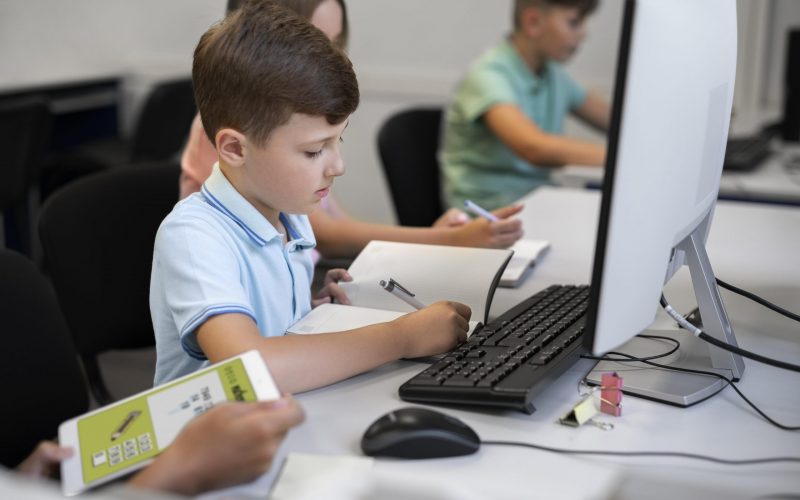 close-up-kid-while-having-technology-education-class