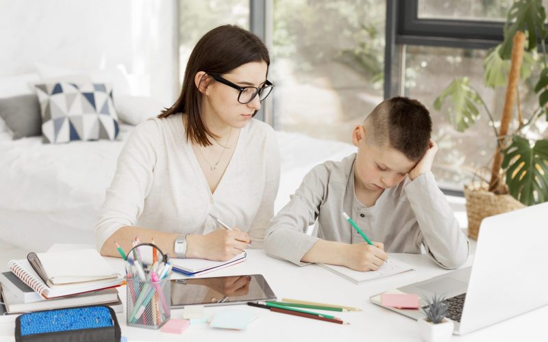 female-tutor-cute-boy-learning-home